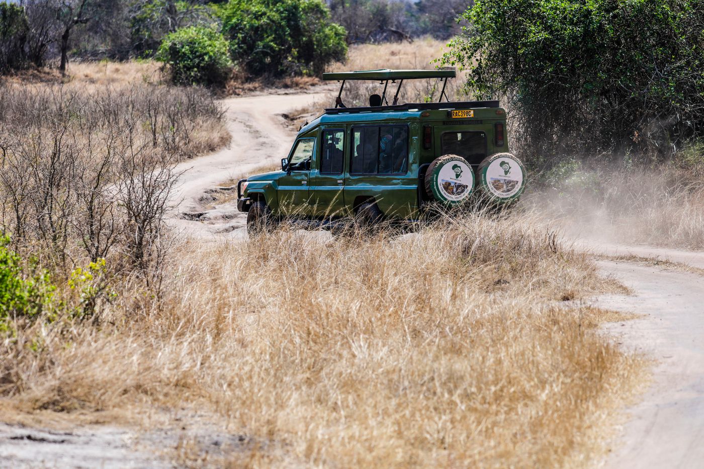 How Much Does a Tanzania Safari Cost in 2026? 2 Safari vehicle on a dusty Tanzania trail