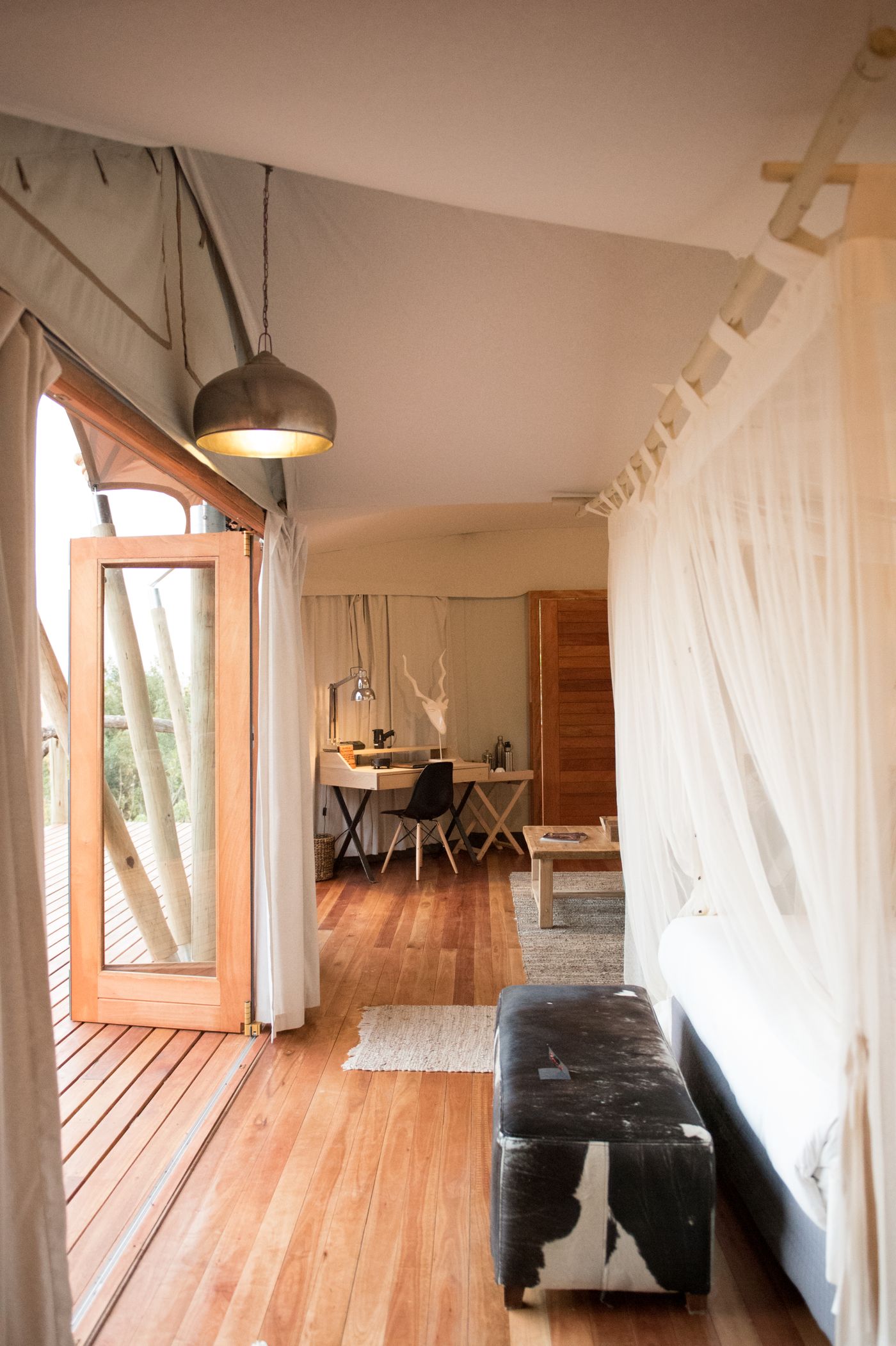 Cozy safari tent interior for romantic glamping
