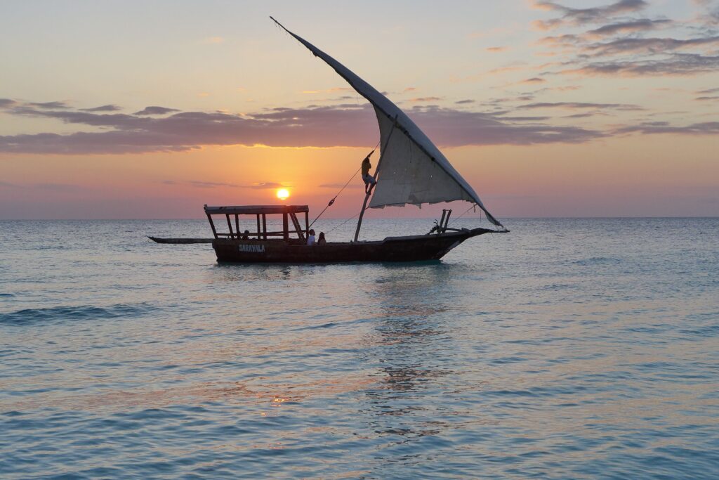 Traditional dhow sailing at sunset on the Indian Ocean
