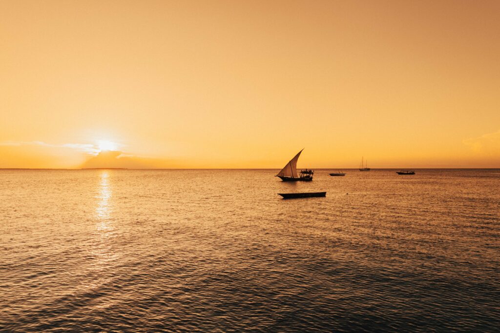 Sailboat on the Indian Ocean at golden sunset