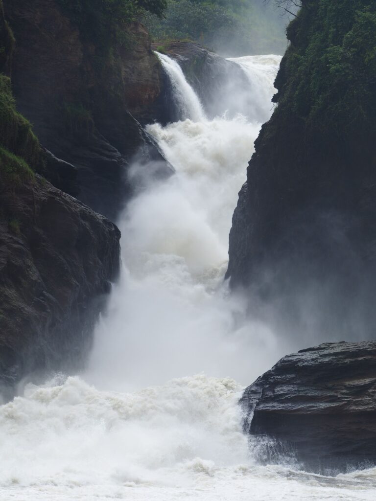 Powerful waterfall cascading through a rocky gorge — Murchison Falls style