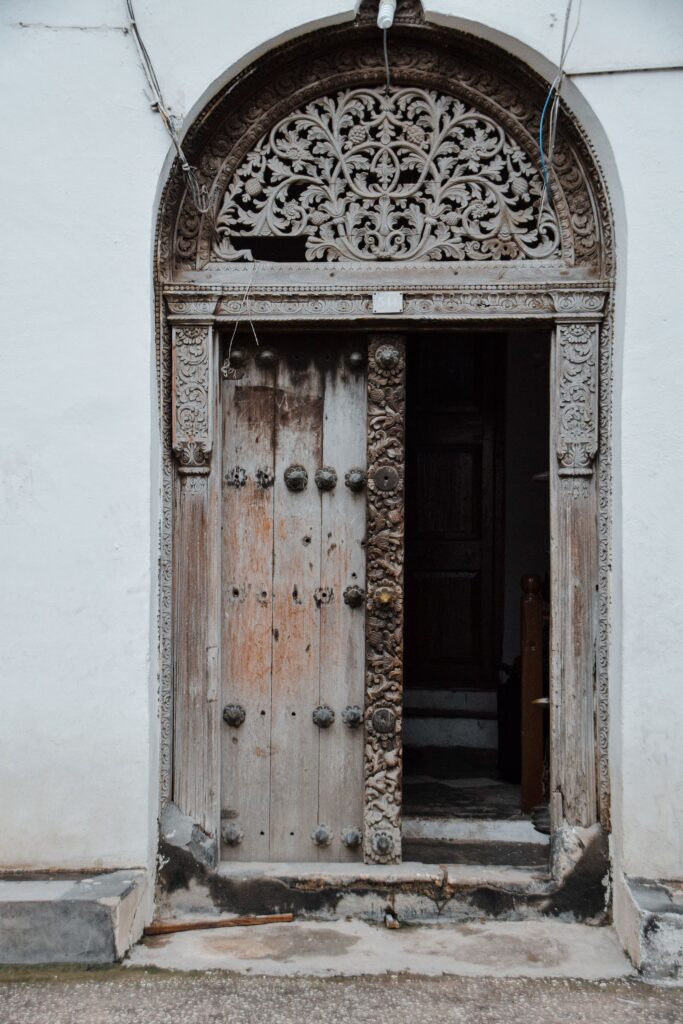 Ornate carved wooden door entrance in Stone Town, Zanzibar
