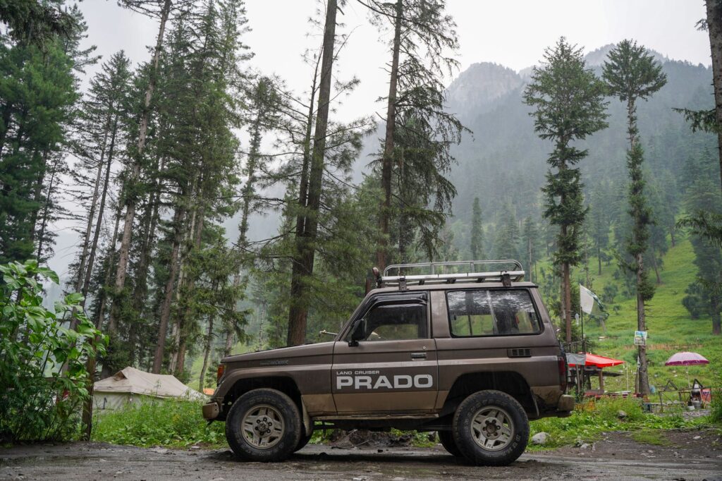 Gorilla Trek Vehicle Hire 2 Empty Land Cruiser parked in a foggy forest ready for gorilla trek logistics