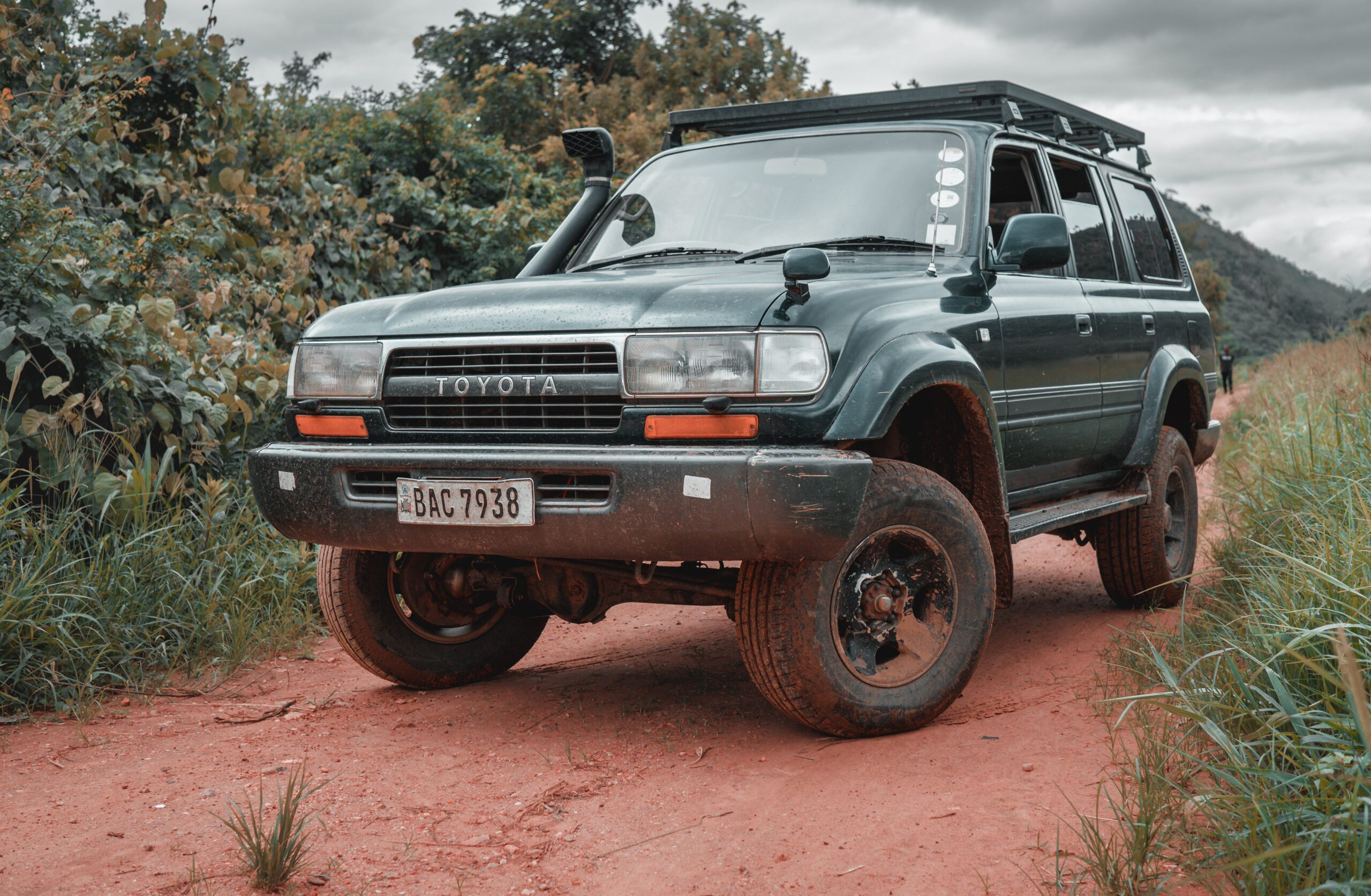 Safari Land Cruiser 4x4 on a dirt road with no passengers visible