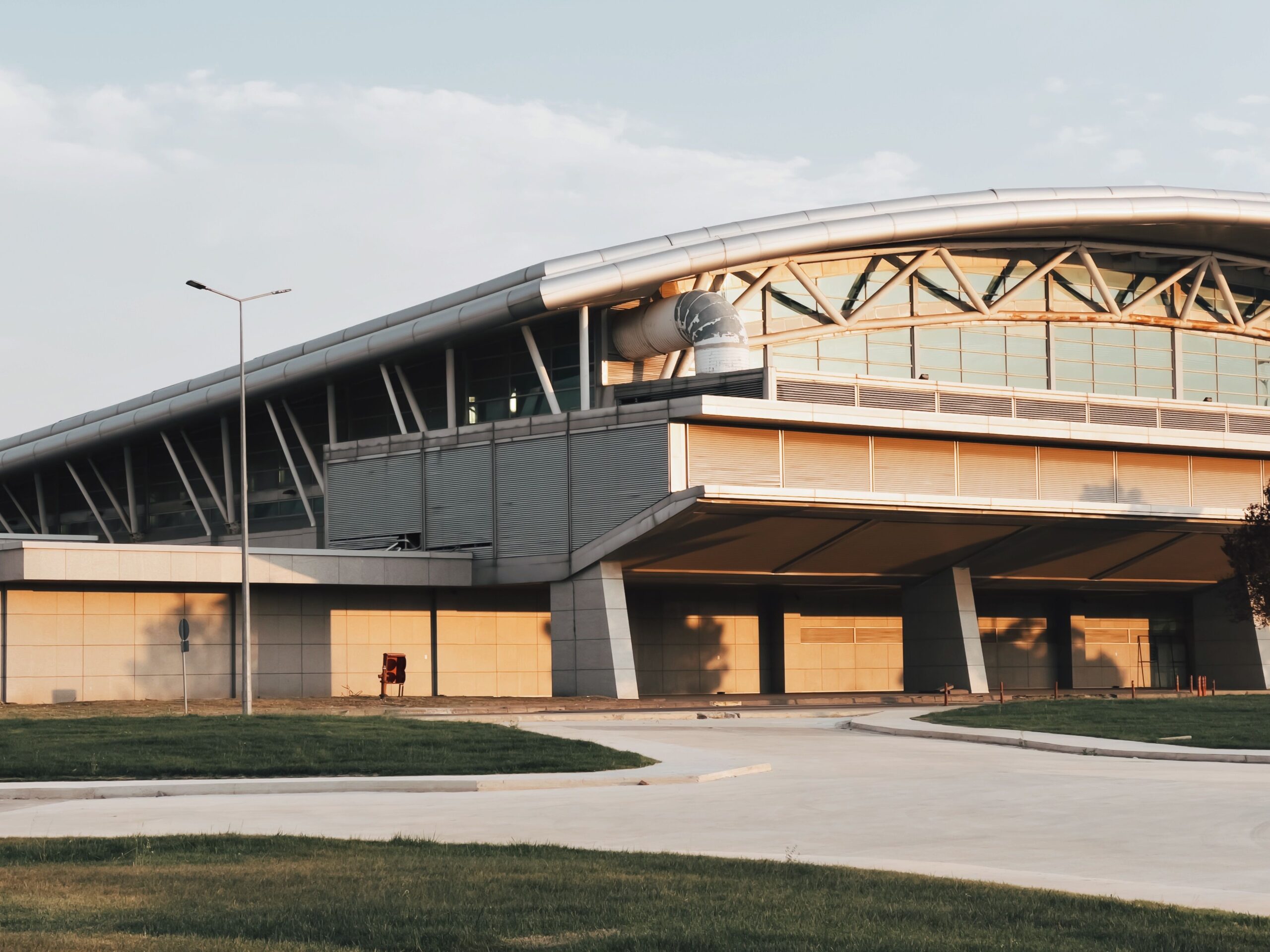 Modern airport terminal exterior for private transfer pickup