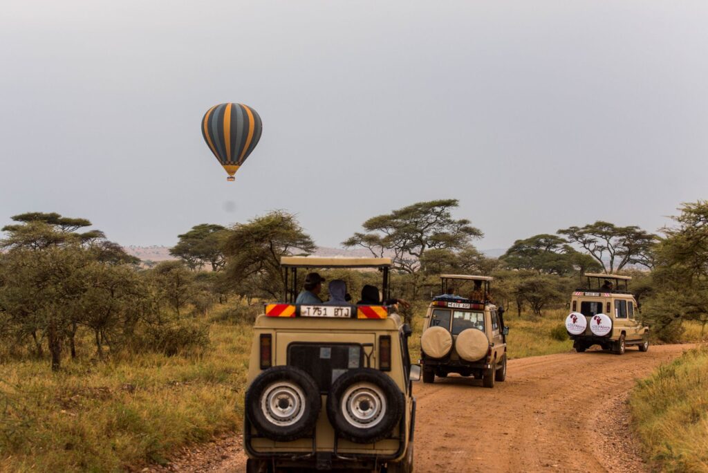 Self-Drive & 4x4 Hire 3 Safari vehicles on Tarangire savannah with hot air balloon — private safari vehicle hire