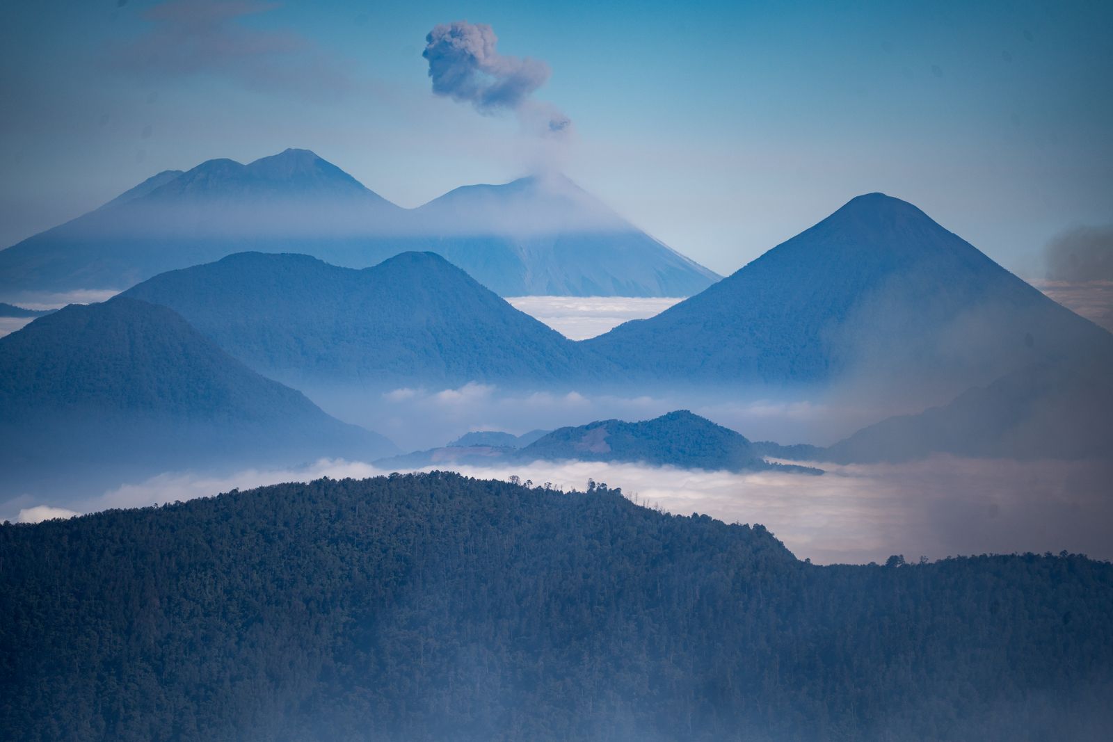 Rwanda Kigali Transfers & 4x4 4 Misty volcanic peaks above the clouds near Volcanoes National Park