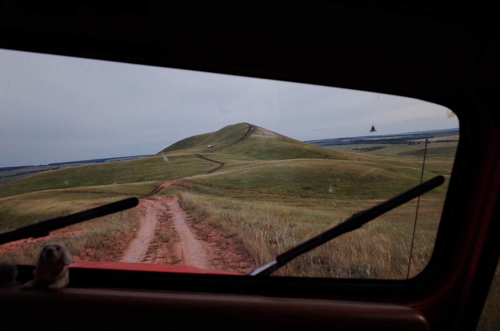 Rwanda Self-Drive 4x4 Hire 1 Self-drive view of a red-dirt road over rolling green hills