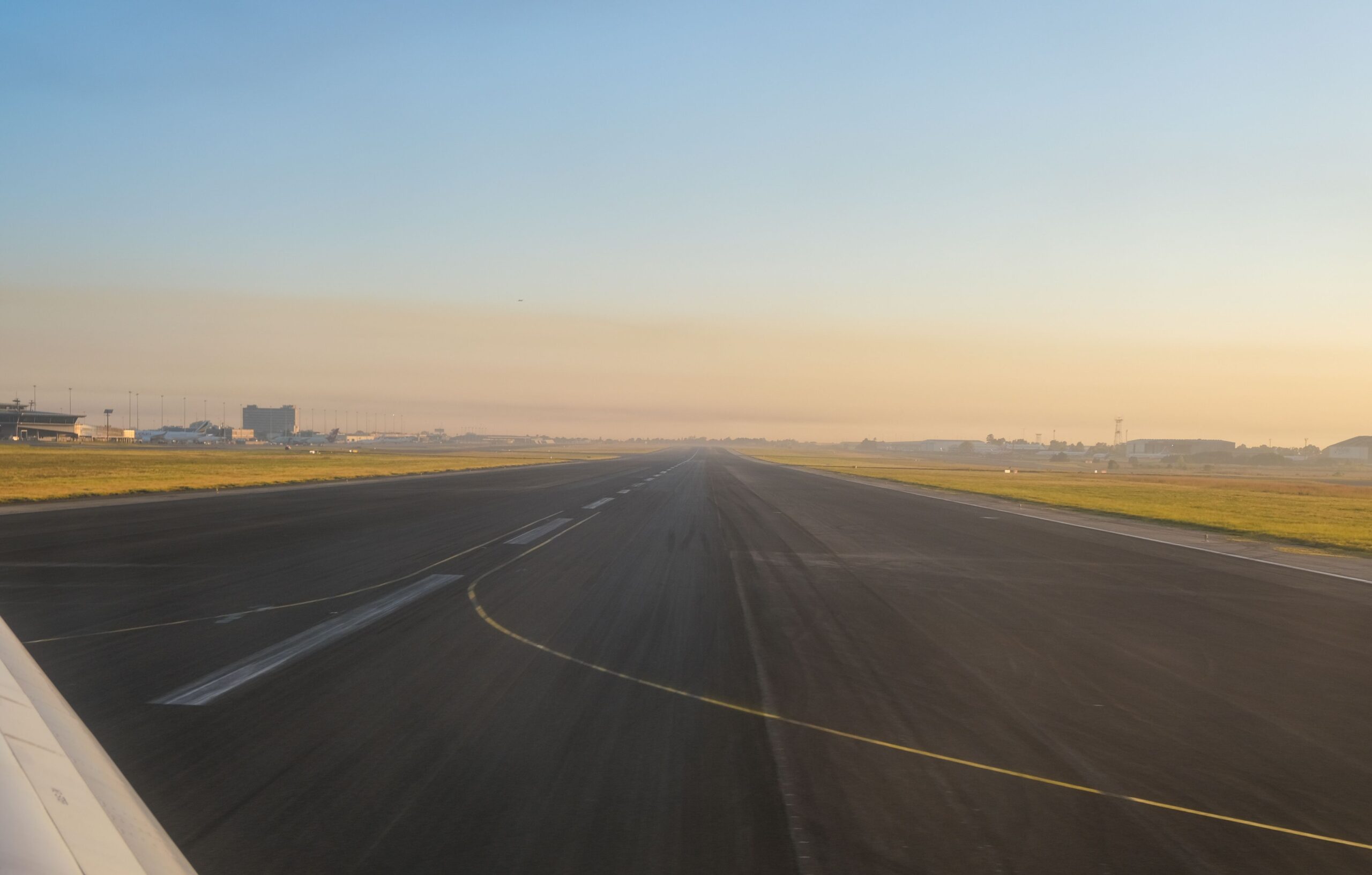 Uganda Safari Vehicle Hire 2 Airport runway at sunrise for Entebbe airport transfer