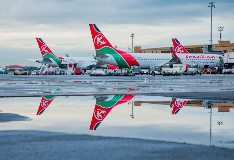 JKIA vs Wilson Airport for a Masai Mara Safari Week (2026) 3 Commercial jets on the wet tarmac at Nairobi JKIA after an international arrival